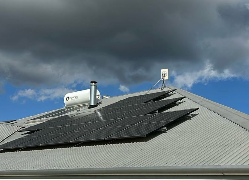 Solar panels on a hip roof under a big Perth sky