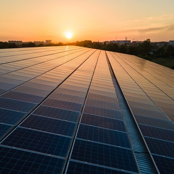 Blue,Photovoltaic,Solar,Panels,Mounted,On,Building,Roof,For,Producing